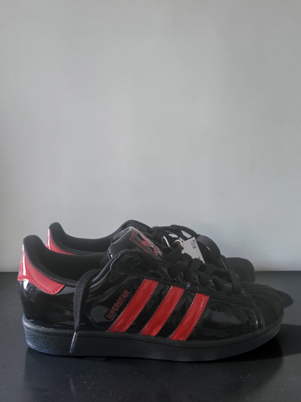 Adidas Superstar Black Patent Sneakers with Red Stripes
